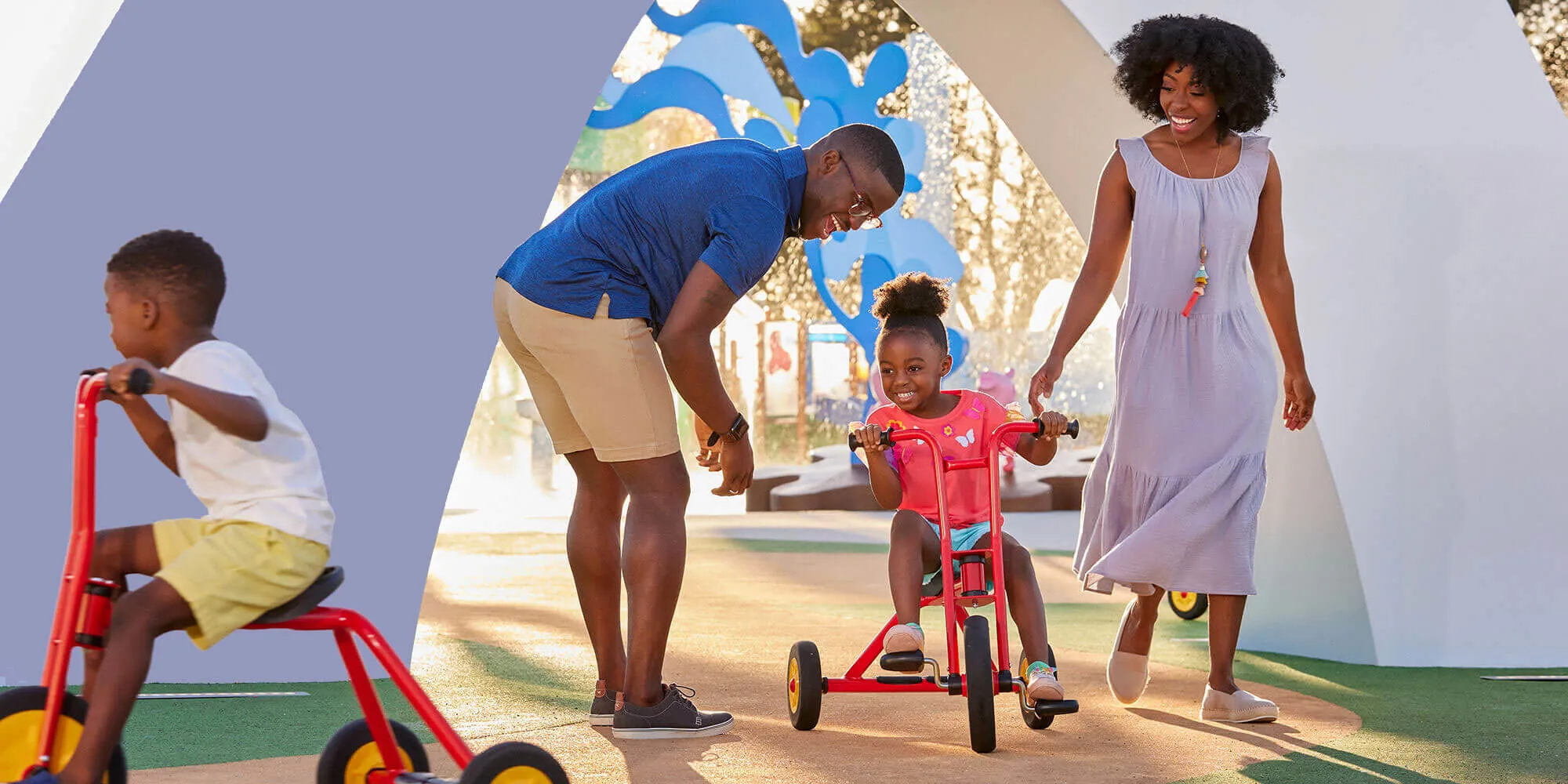 father, mother, son and daughter at Peppa’s Pedal Bike Tour and George’s Tricycle Trail at Peppa Pig Park